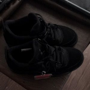 Black Cat Jordan 4s